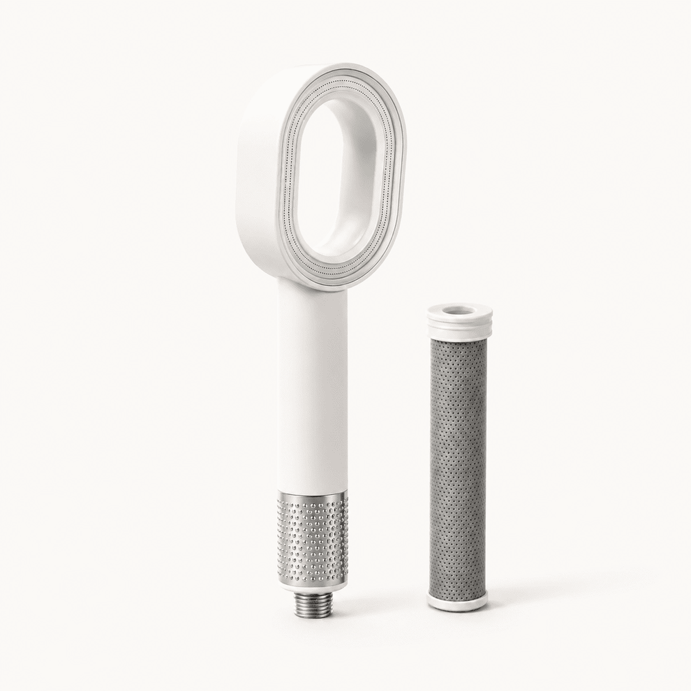 Filtered shower head and activated carbon filter cartridge on a neutral background.